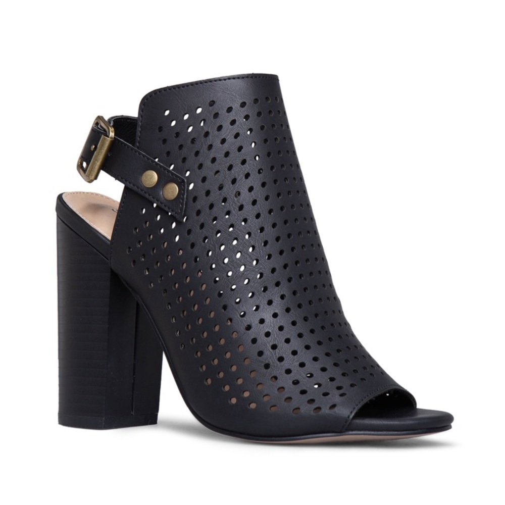 Perforated block heel sandal with open back and adjustable ankle strap.